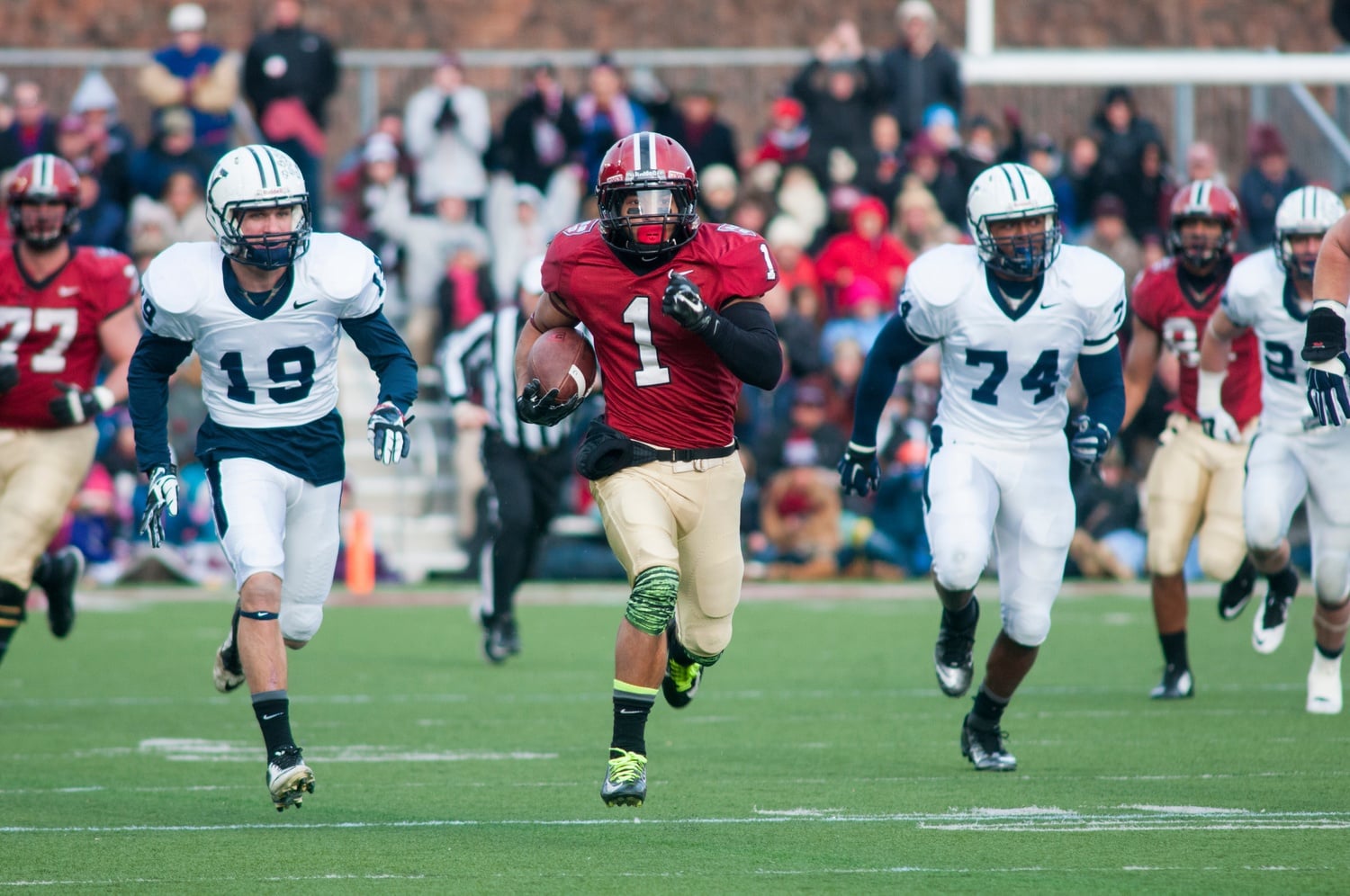 Senior receiver Andrew Fischer, pictured above in the Crimson’s victory in 2014 over Yale, recorded the game-winning touchdown to top the Elis, 31-24.