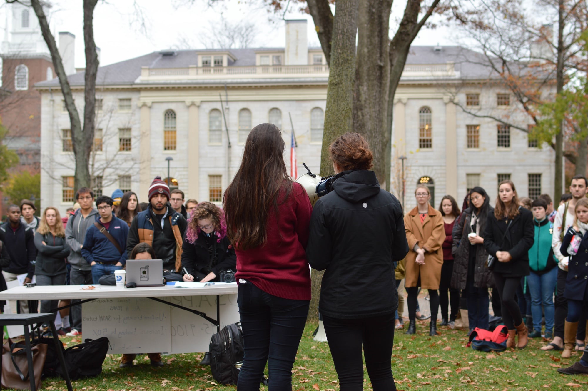 More than 80 undergraduates convened outside Massachusetts Hall to call on the College to commit more resources and attention to preventing sexual assaults on campus at a rally on Thursday.