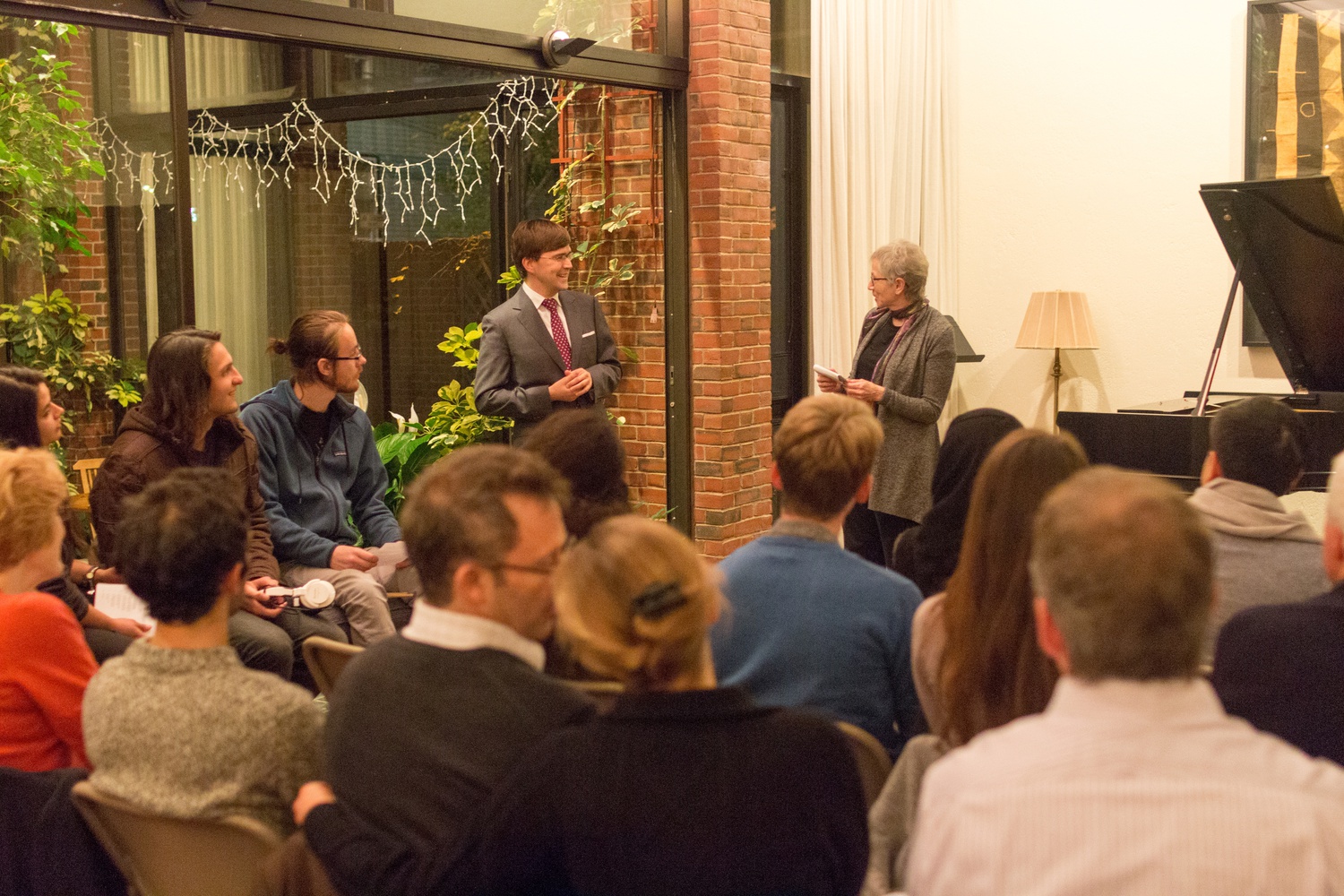 Christie McDonald, a Mather House master, introduces pianist Paavali Jumppanen as part of the “Mather Music” concert series.
