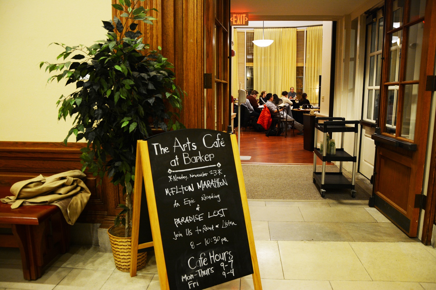 Students take turns reading during a John Milton reading marathon of "Paradise Lost" at the Barker Center Café on Monday night.