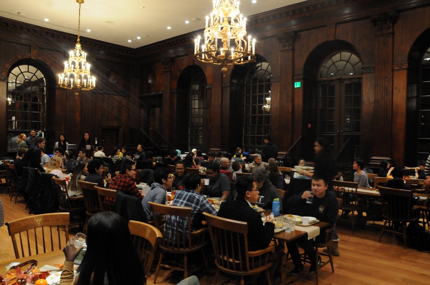 Students staying on campus during Thanksgiving break celebrate over dinner in Dunster House on Thursday evening.