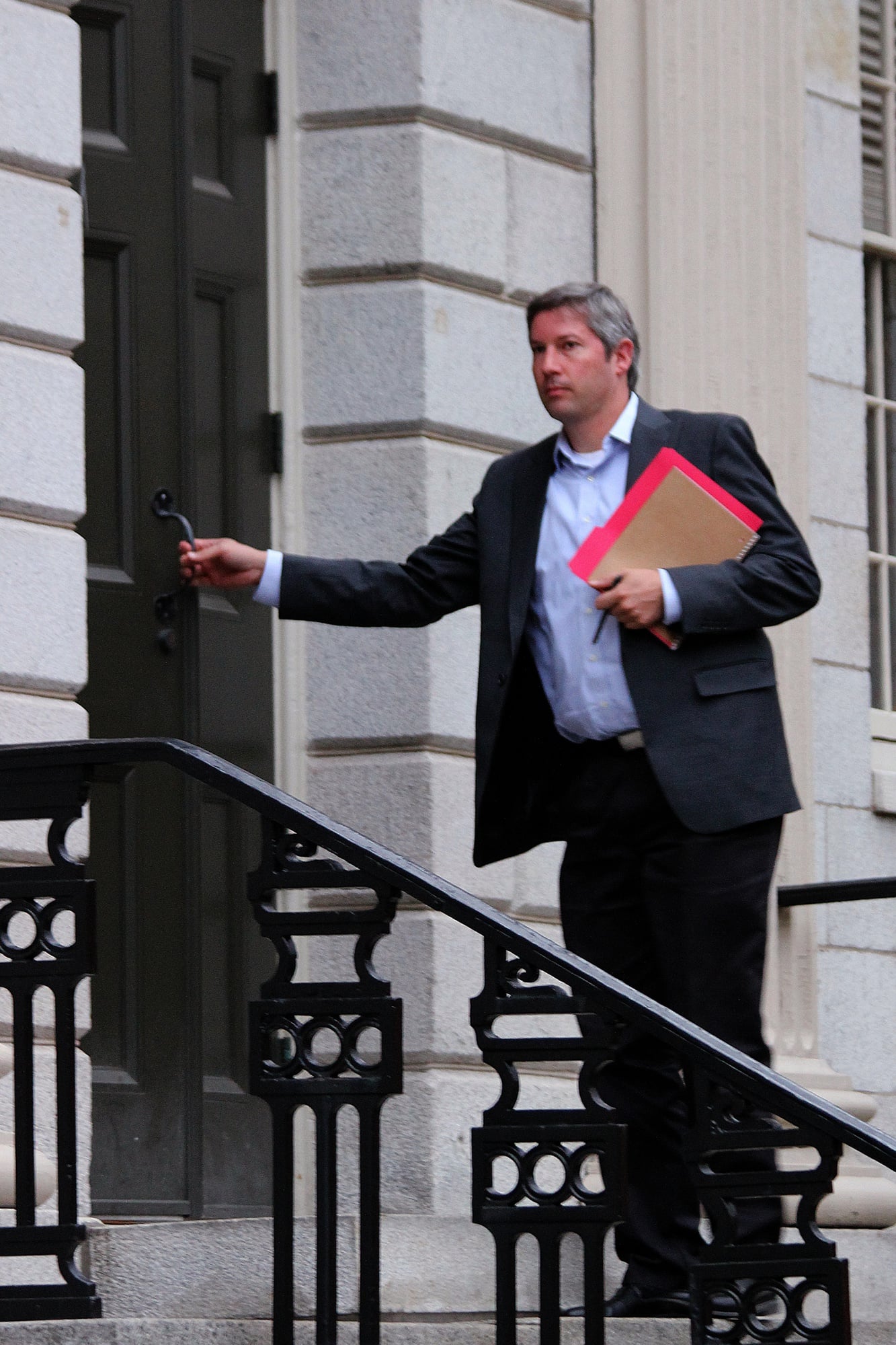University President Drew G. Faust’s senior special assistant, Lars P.K. Madsen, enters University Hall before the December faculty meeting.