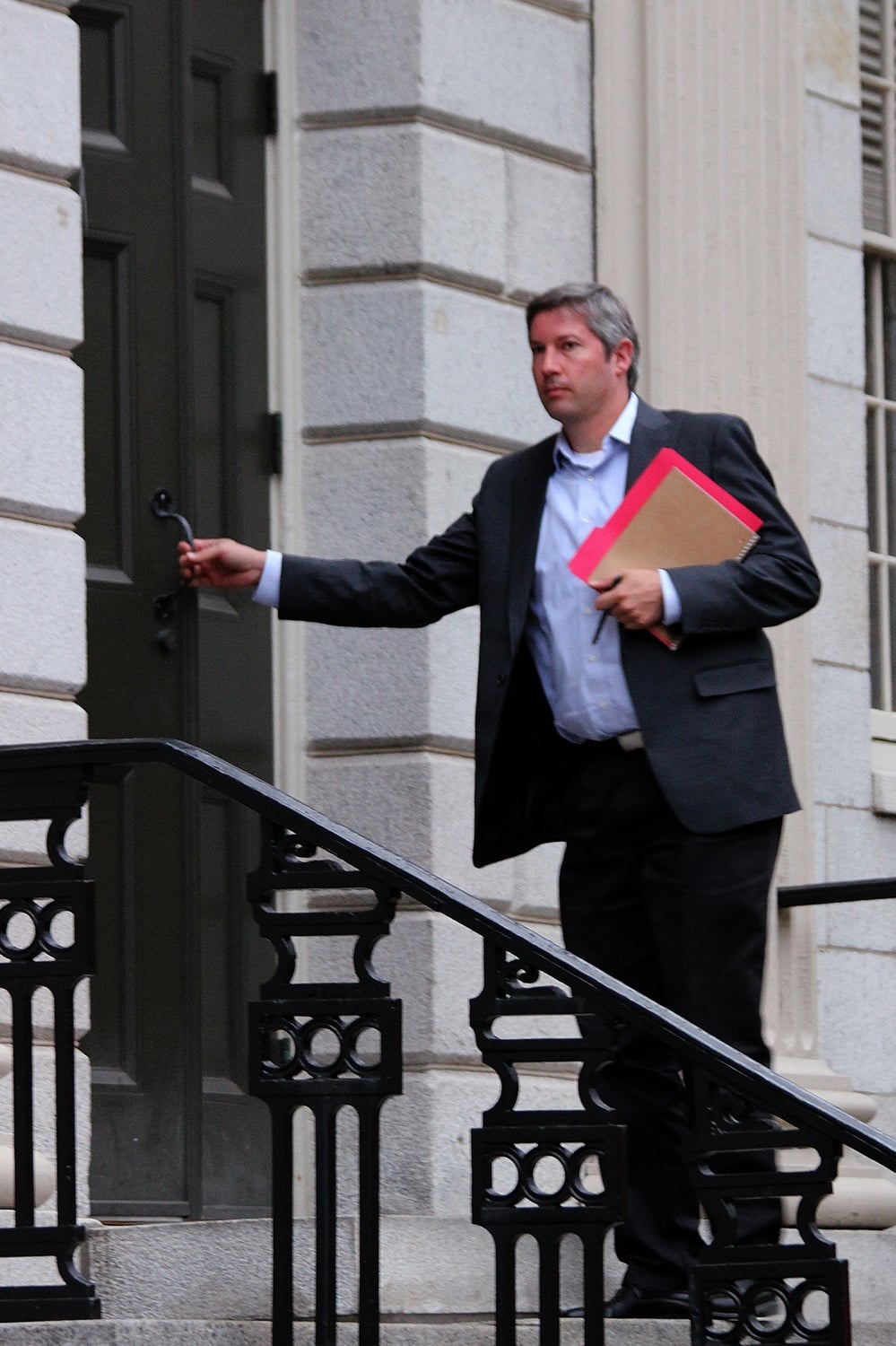 University President Drew G. Faust’s senior special assistant, Lars P.K. Madsen, enters University Hall before the December faculty meeting.