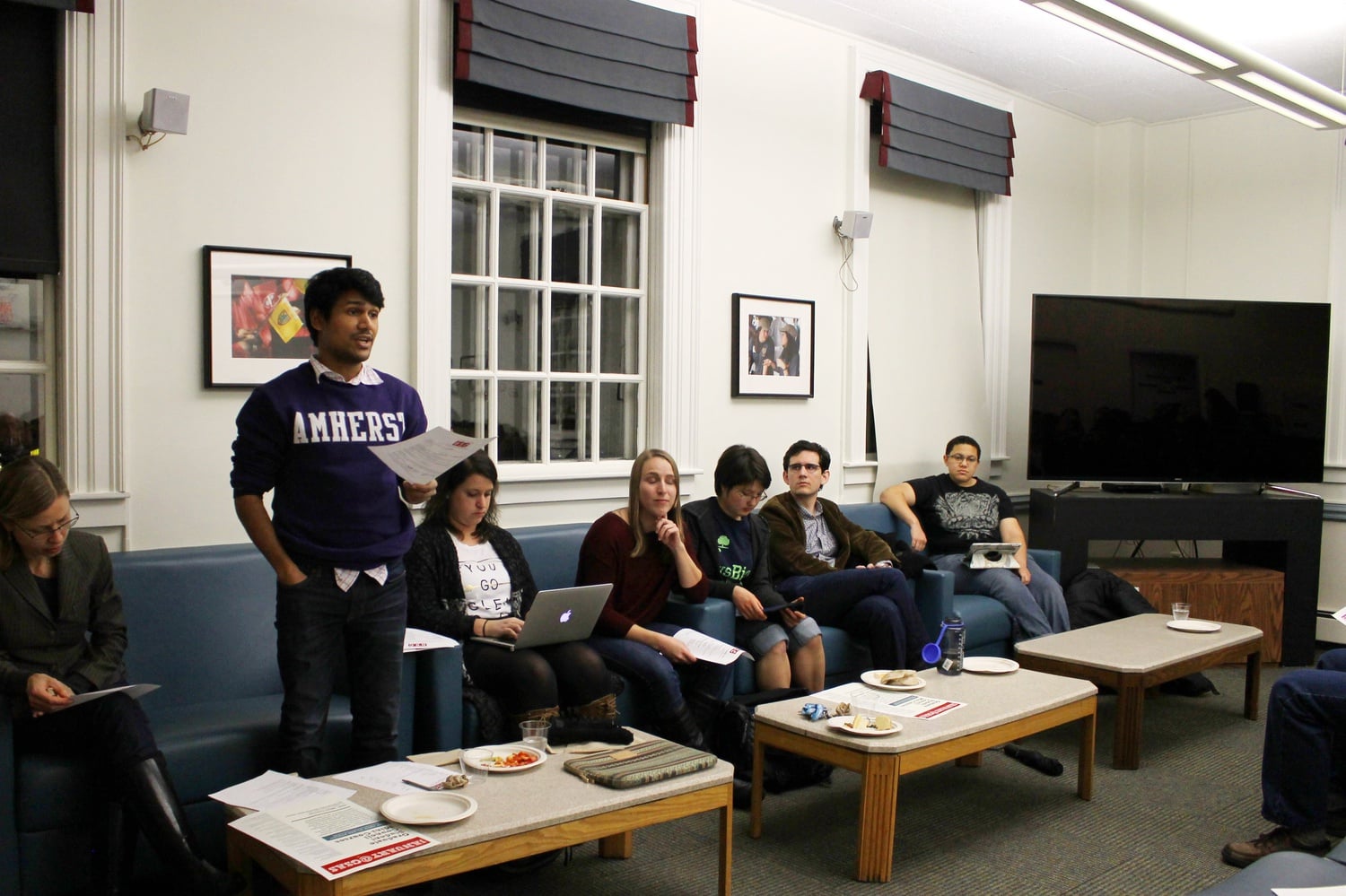 Rohan Mazumdar, treasurer of the Graduate Student Council, announces funding for graduate student clubs on Wednesday evening at the Graduate Student Council meeting in Dudley House.