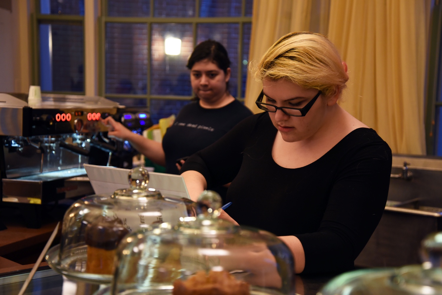 Gabby D. Aguirre '17 prepares for her shift at the Barker Center's Arts Cafe on Wednesday afternoon.