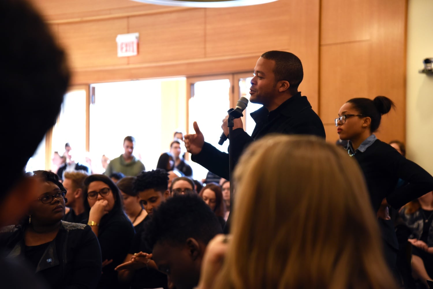 Joehn J. Favors, a second-year student at Harvard Law School and Winthop House tutor, invites Dean Martha L. Minow to respond at the community meeting on Friday afternoon.


