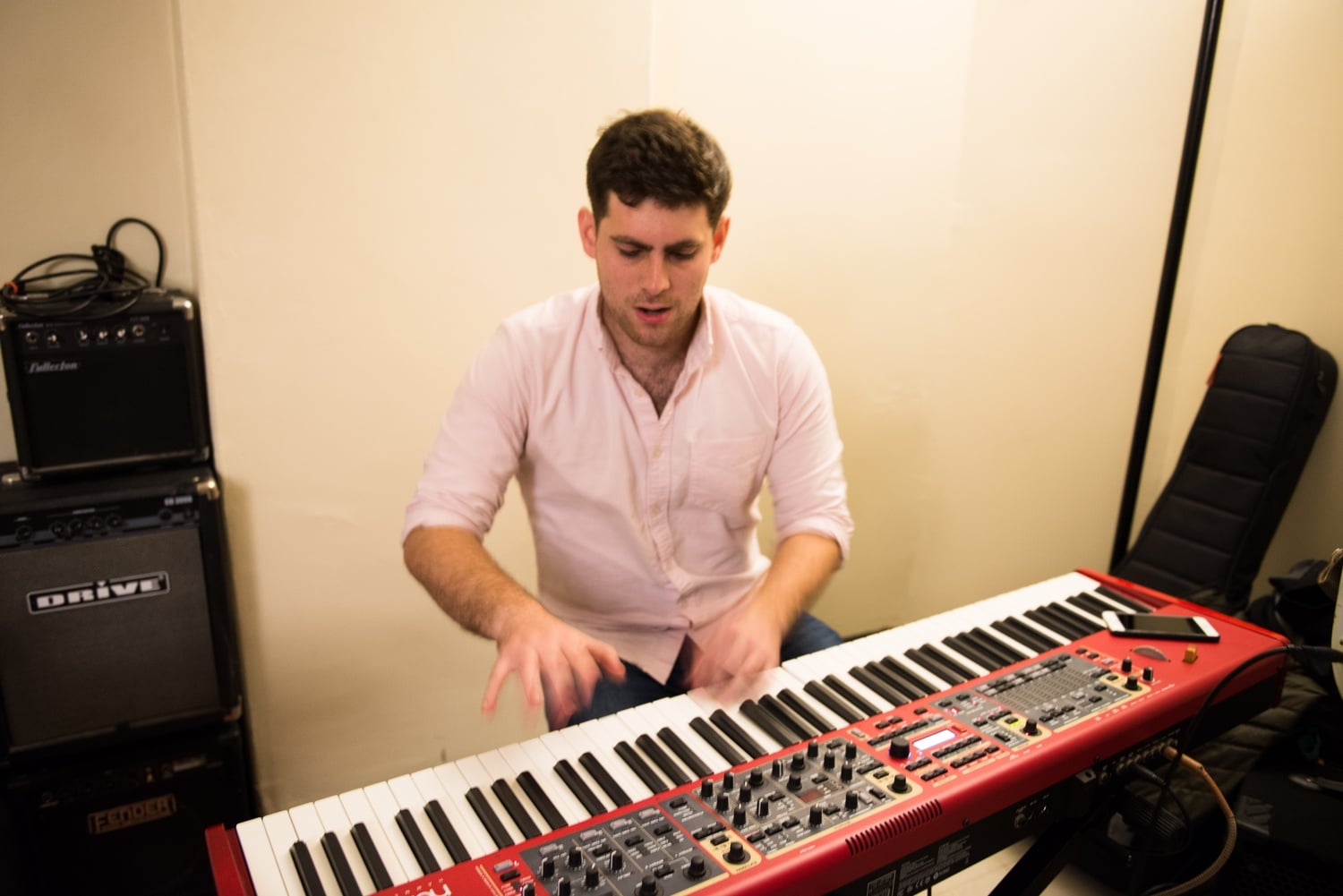 Ethan I. Simon '16 plays keyboard during a rehearsal for the Intrinsics, a band he founded with a graduate of 2014. 