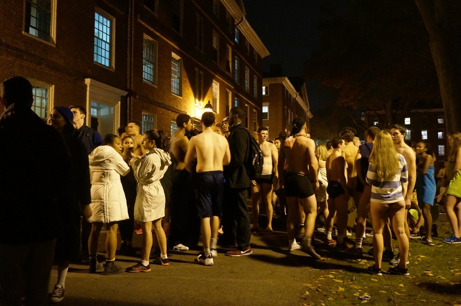 Students gather in Harvard Yard at midnight on Thursday for Primal Scream.