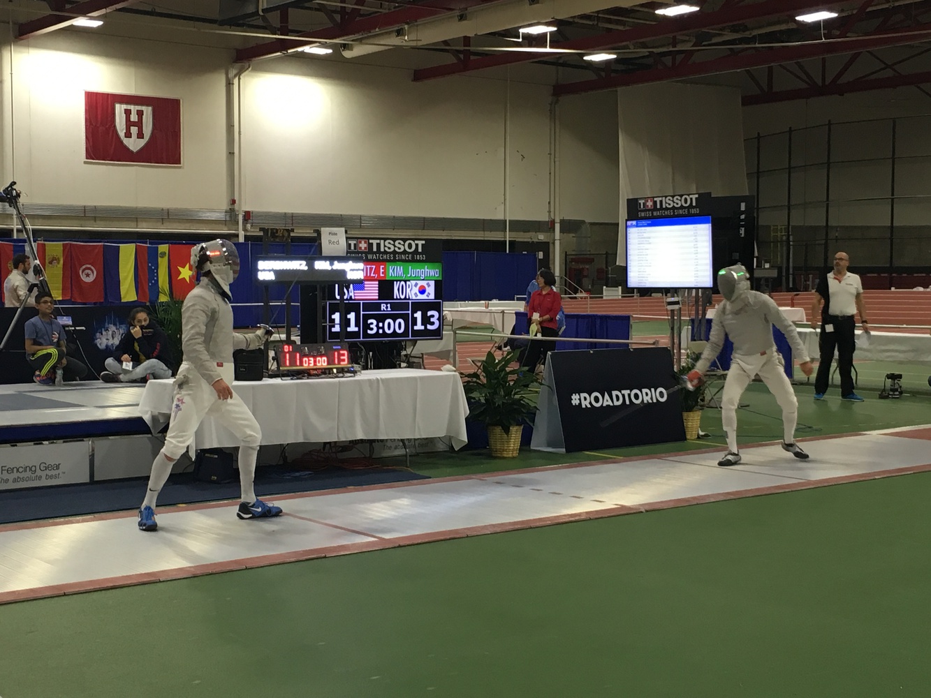 Harvard fencer Eli Dershwitz (left) faces off against Korea's Junghwan Kim, the No. 2-ranked men's saber fencer in the world.