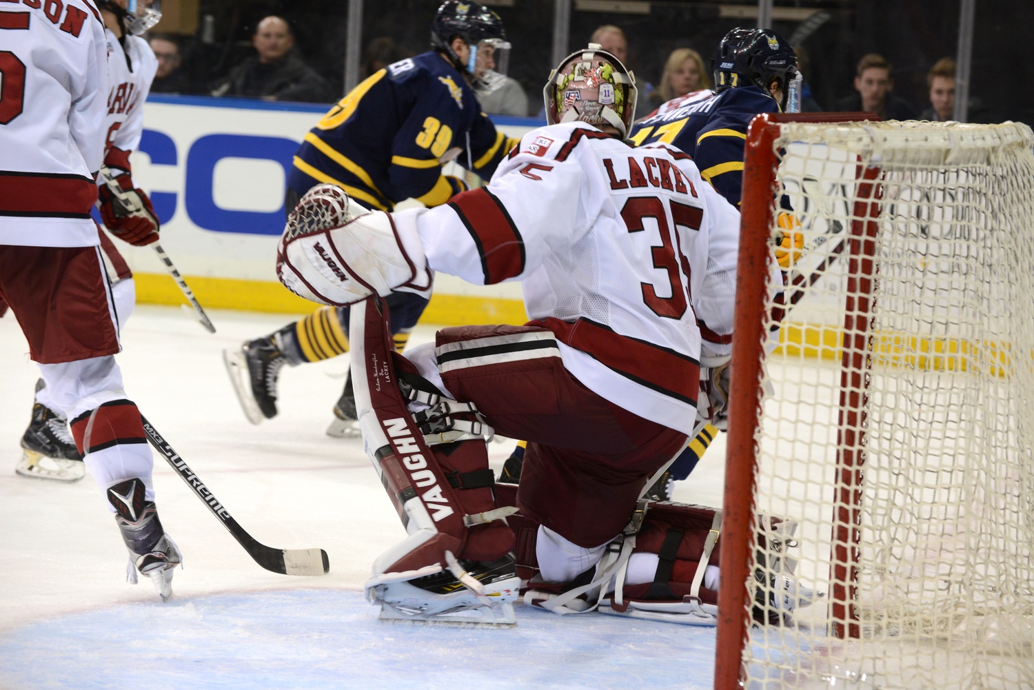 Michael Lackey started in net for the Crimson. But after conceding three goals, the rookie was replaced by sophomore Merrick Madsen