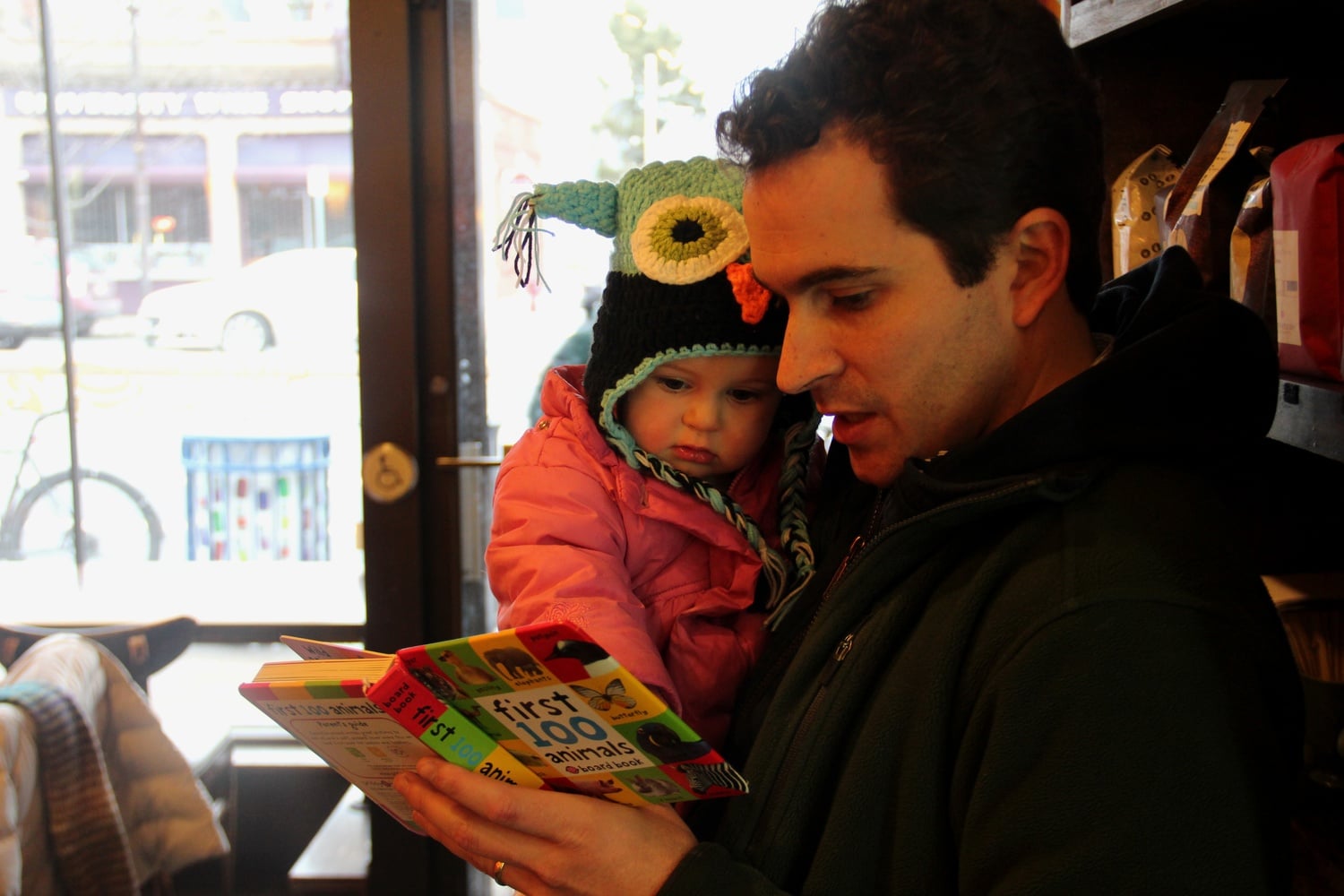 Professor Cushman reads to his daughter Nell after breakfast at Simon's, a daily pre-drop off activity.