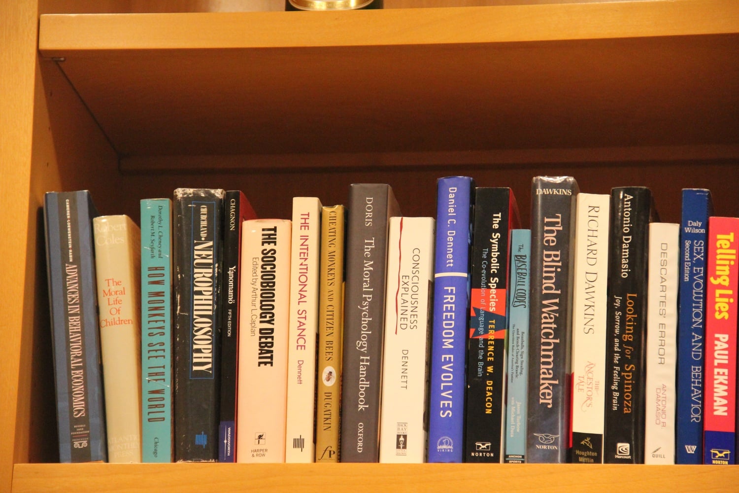 A shelf on Professor Cushman's bookshelf