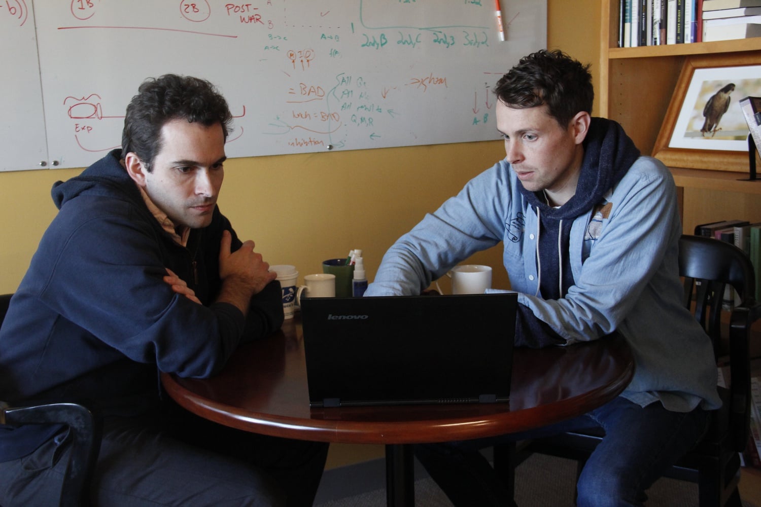 Professor Cushman discusses lab work with a colleague.