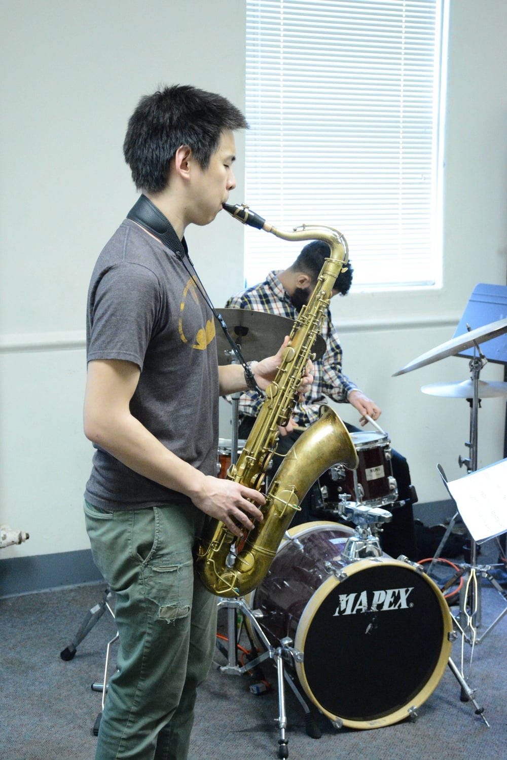 Saxophonist Kevin Sun ’14, a former FM exec, rehearses with Great on Paper at the New England Conservatory of Music on Tuesday, February 2. 