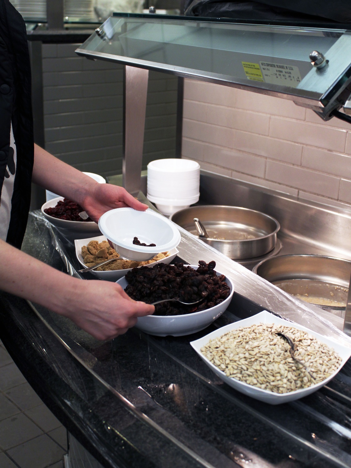 A freshman student helps themselves to oatmeal at Brain Break in Annenberg Hall Tuesday night. Oatmeal and a variety of other foods have been added to the Brain Break selection for freshmen this semester.