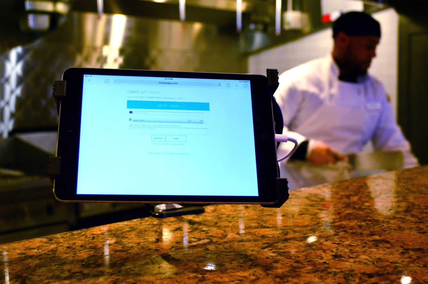 A tablet in Cabot dining hall displays the Mange app, which students use to electronically place grill orders.