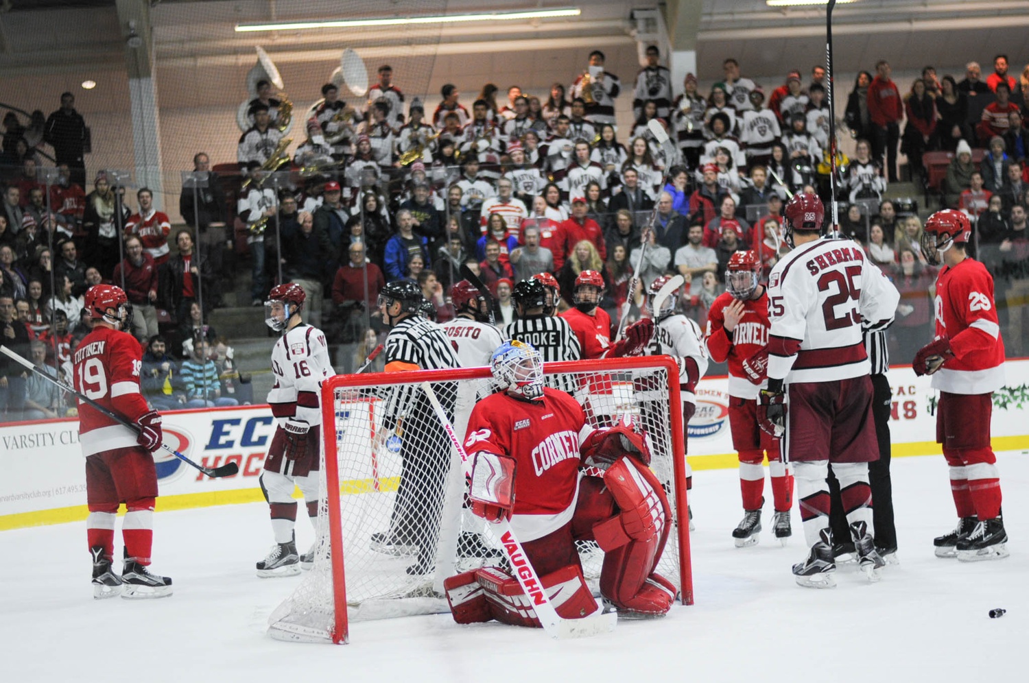 Scrums such as this one where Mitch Gillam's net came off its hinges appeared with regularity Friday night as Harvard and Cornell battled to a physical 2-2 draw at the Bright-Landry Hockey Center.