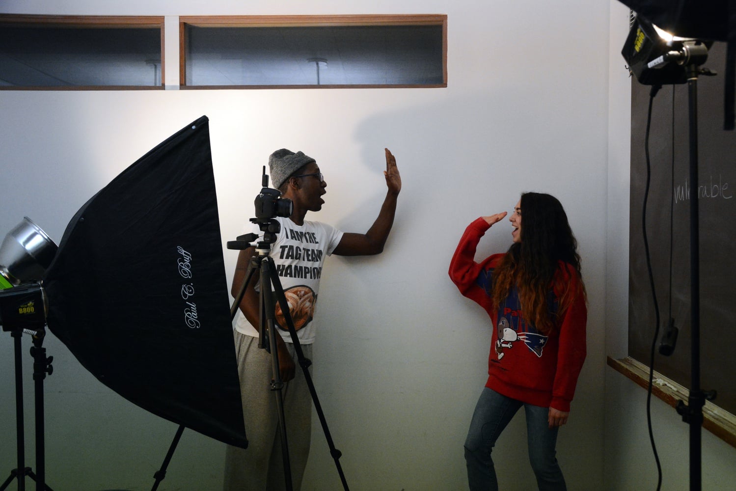 Ella M. Duncan ’17 high-fives photographer Steve Osemwenkhae after participating in his project “No Makeup Series,” which aims to highlight the natural beauty of women through headshots paired with personal reflections.
