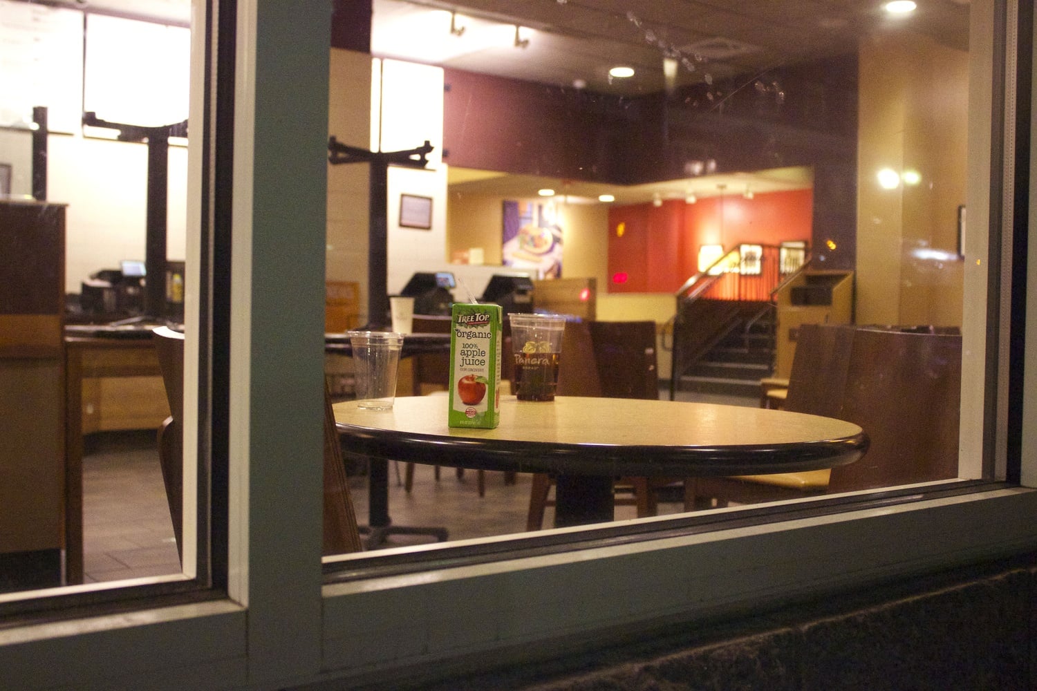 A juicebox and soda sit abandoned on a table after Panera announced that it is closing indefinitely. 
