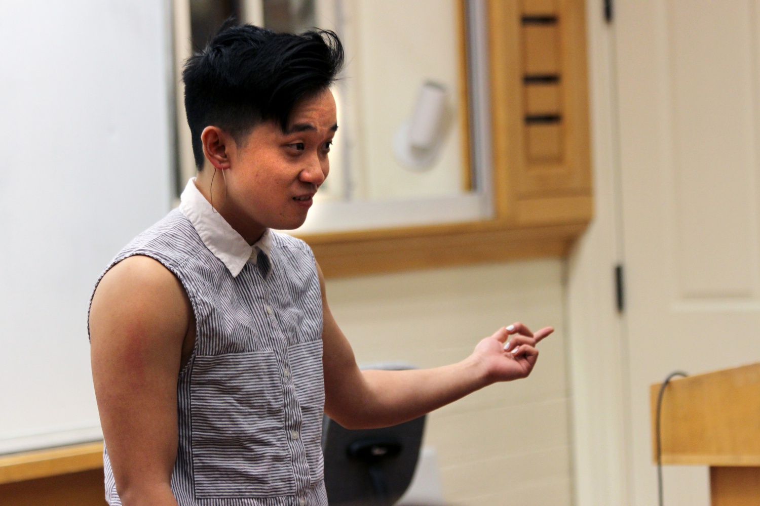 Chinese-Singaporean multimedia artist Bex H. Kwan ‘14 performs Spoken Word at Holden Chapel Thursday evening. As a student, Kwan received the Outstanding Student Leader Award by the Office of BGLTQ Student Life.