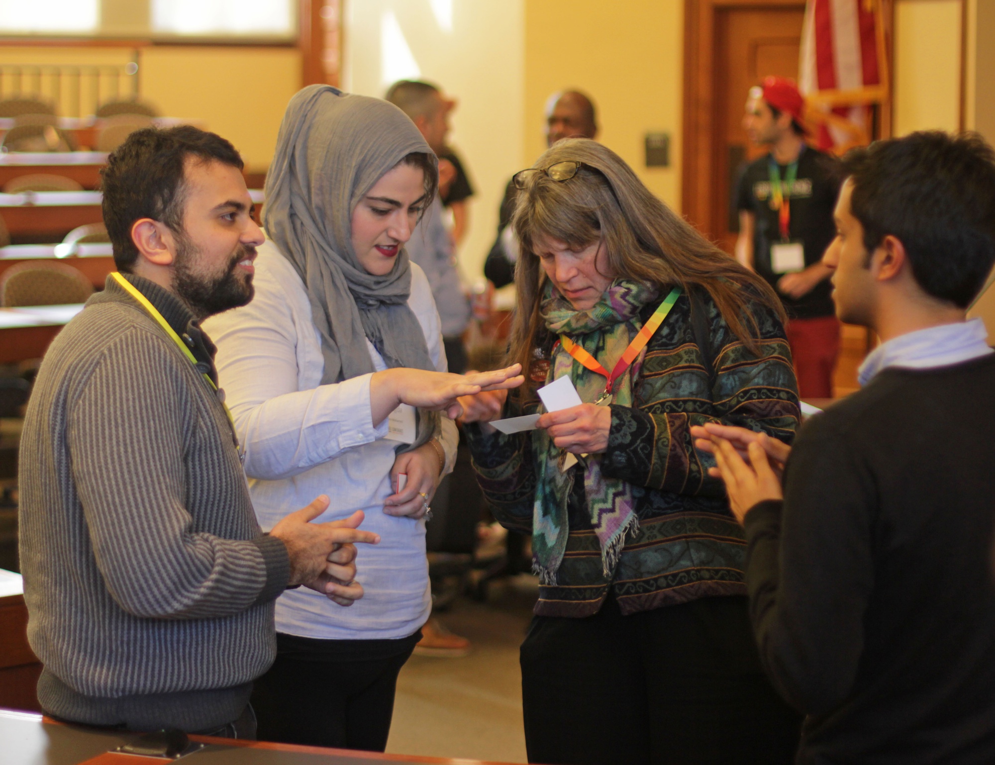 Conference attendees mingle after the “Comparative Religions” session at the LGBTQ Conference at Harvard. The third edition of the conference, the theme of which was “Beyond Marriage Equality: Rainbows at the Crossroads,” took place this weekend on the law school campus.