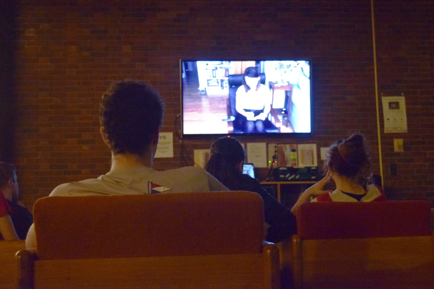 Students watch the premiere of Mather Be, Mather House's 2016 Housing Day video, which parodies Clean Bandit's song Rather Be.