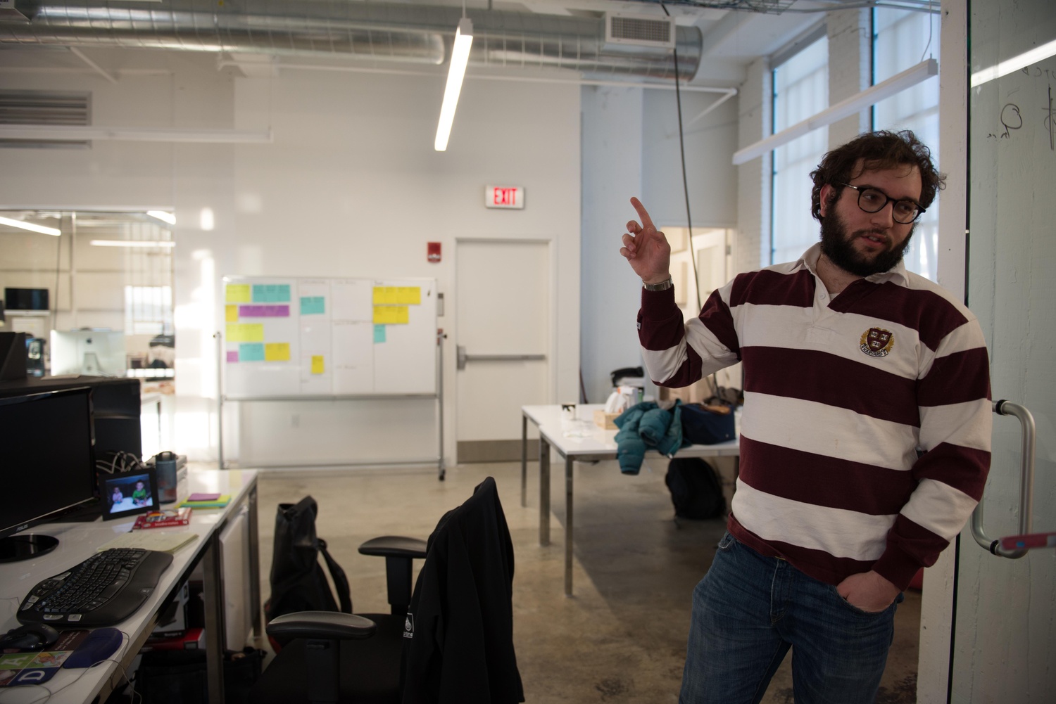 John Capodilupo gestures across WHOOP’s office. WHOOP is a bracelet that Harvard athletes wear that tracks sleep and diet, among other elements of life outside of practice.