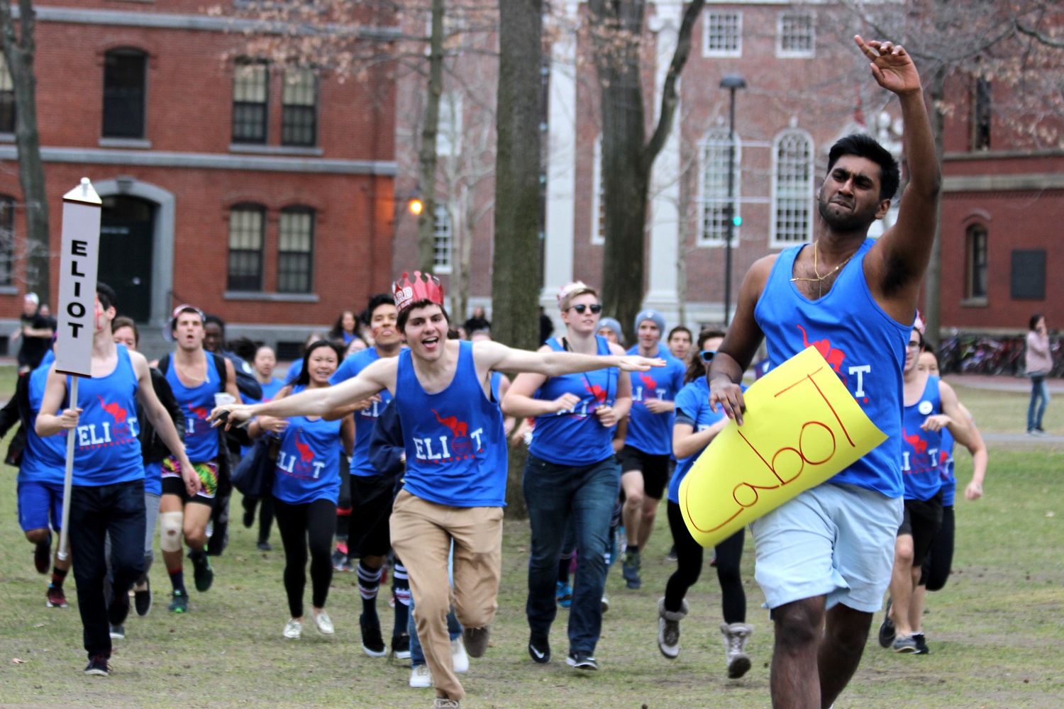 Members of Eliot House charge into Harvard Yard pn Housing Day.