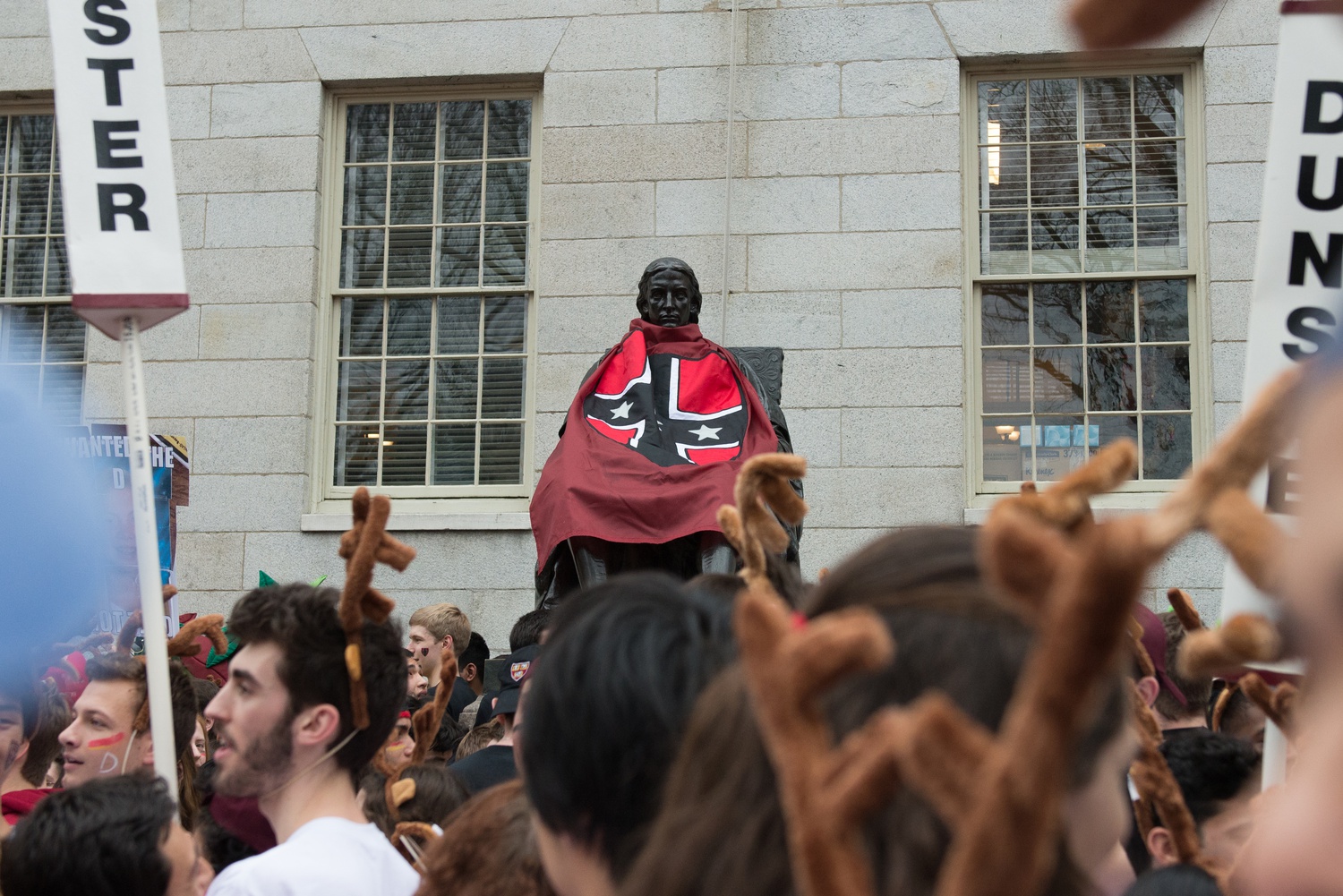 Kirkland students climbed the John Harvard Statue and donned it in their flag, much to the chagrin of other Houses.