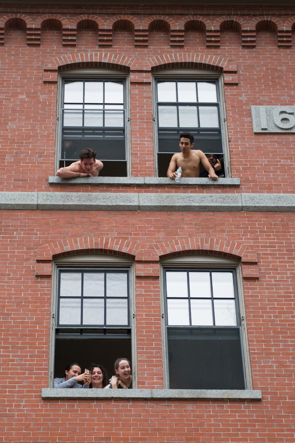 Freshmen in Grays Hall eagerly look out into the yard, awaiting their letters.