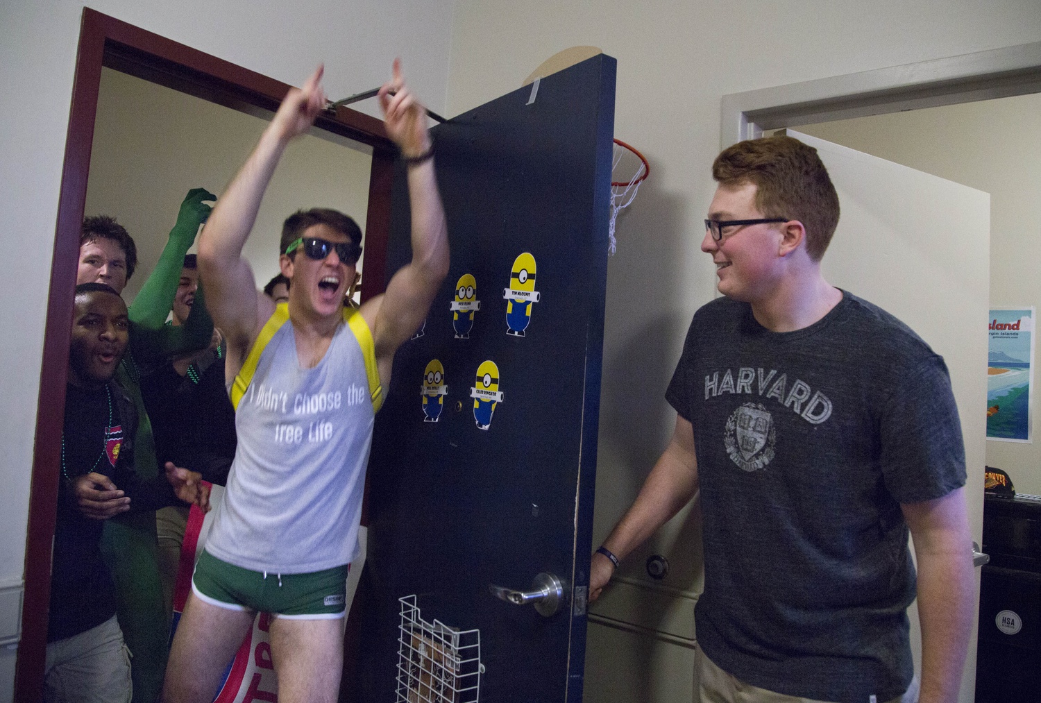 Currier House residents storm into a freshman dorm to notify students of their house placement. “It’s going to be okay,” assured one upperclassmen through a megaphone.