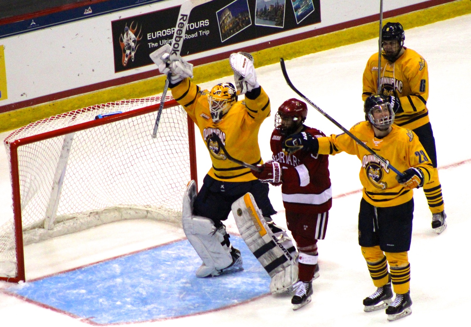 Goaltender Michael Garteig celebrates at time expires in the ECAC title game Saturday night at Herb Brooks Arena. Quinnipiac topped Harvard, 4-1, and Garteig made 24 saves.