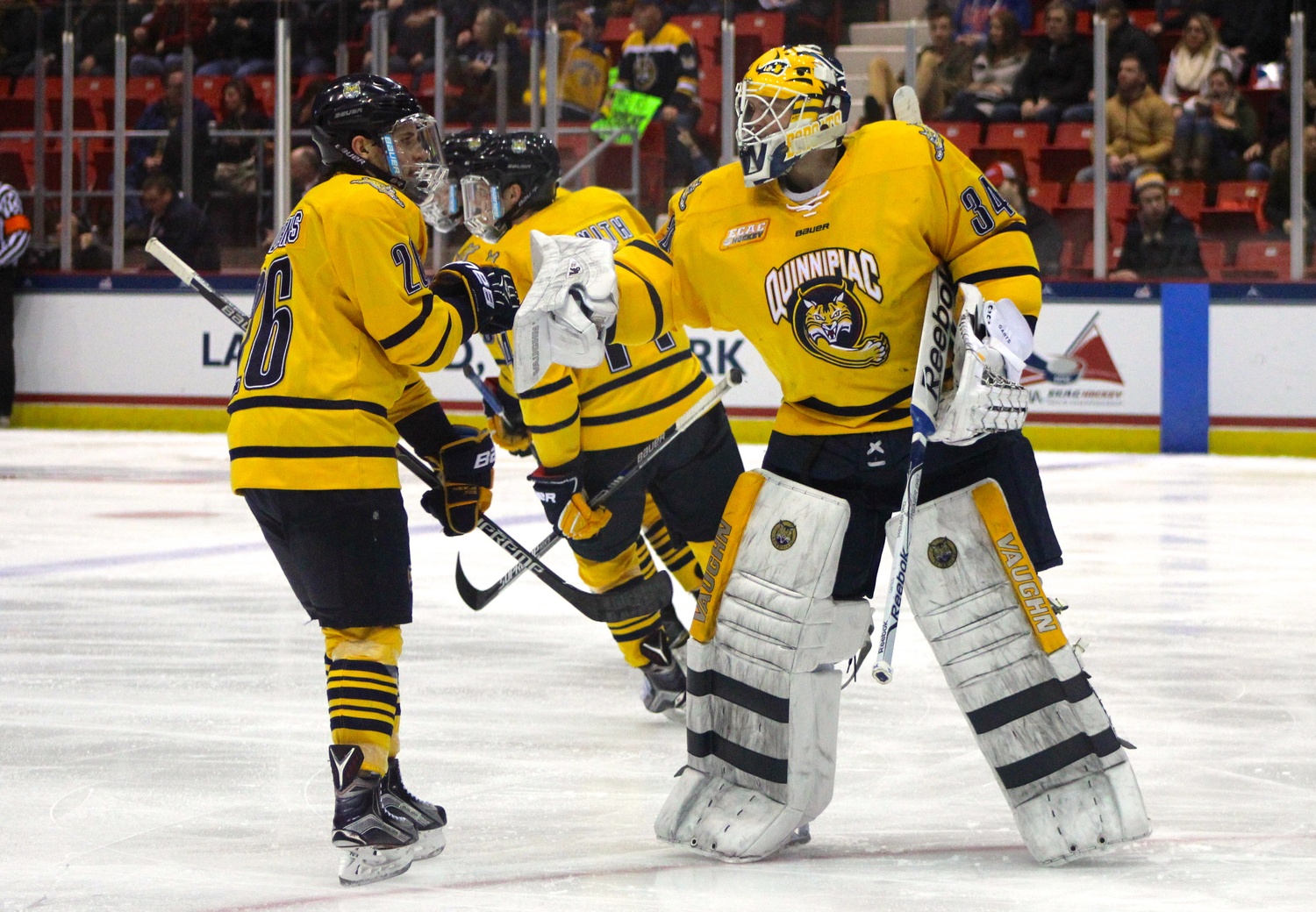 Goaltender Michael Garteig comes out of his net to congratulate his teammates after one of Quinnipiac's three power play goals in the second period.