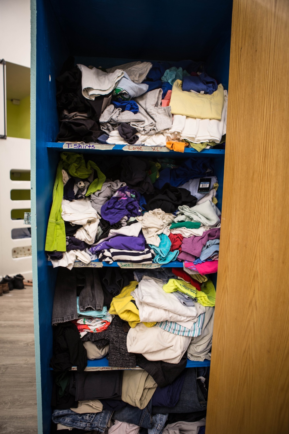 Guests at Y2Y can choose clothes from a row of cabinets which store clothes, ranging from business attire to winter coats and socks.
