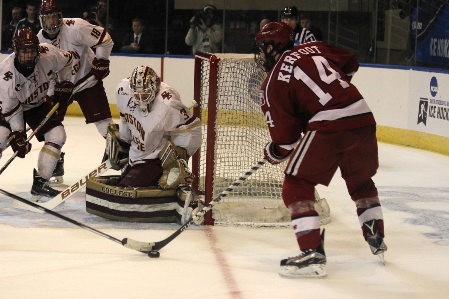 Junior Alexander Kerfoot tries to force Hobey Baker finalist Thatcher Demko make a save. Demko had 32 saves on Fridat