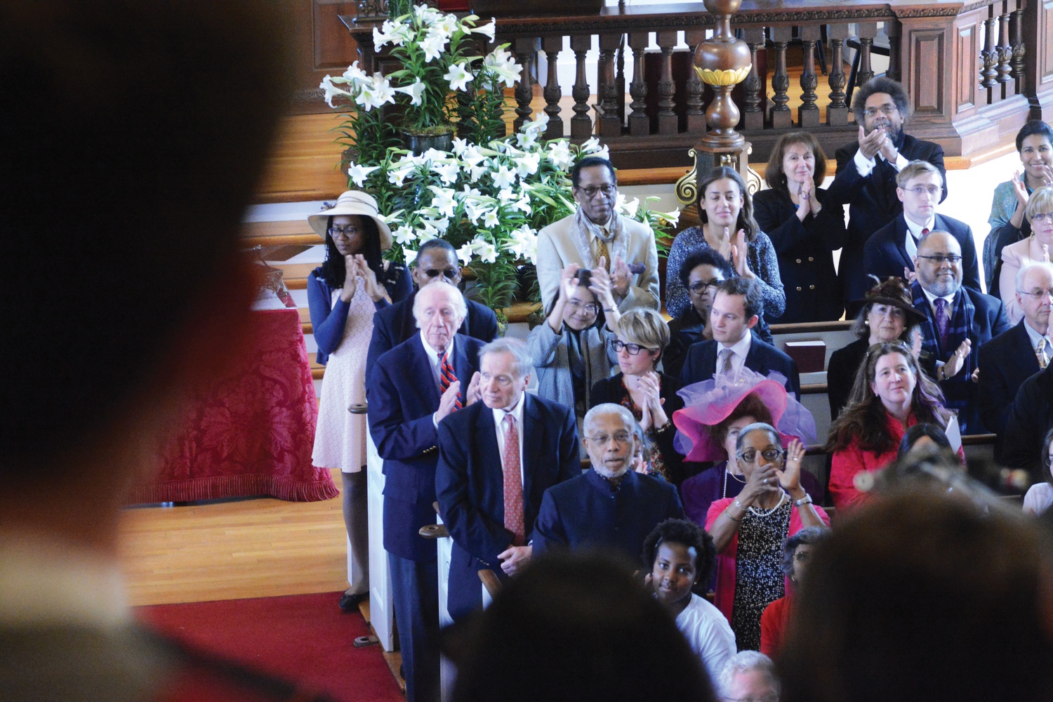 Josh Bean ‘16 and other students perform the Alleluia Choruses during the Easter Service in Memorial Church Sunday morning. Viewing over his shoulder, seen are attendees including Dr. Cornel West, Professor of Philosophy and Christian Practice at Union Theological Seminary and Professor Emeritus at Princeton University, and Dr. S. Allen Counter, Director of the Harvard Foundation for Intercultural and Race Relations and Professor of
Neurology at Harvard Medical School. 