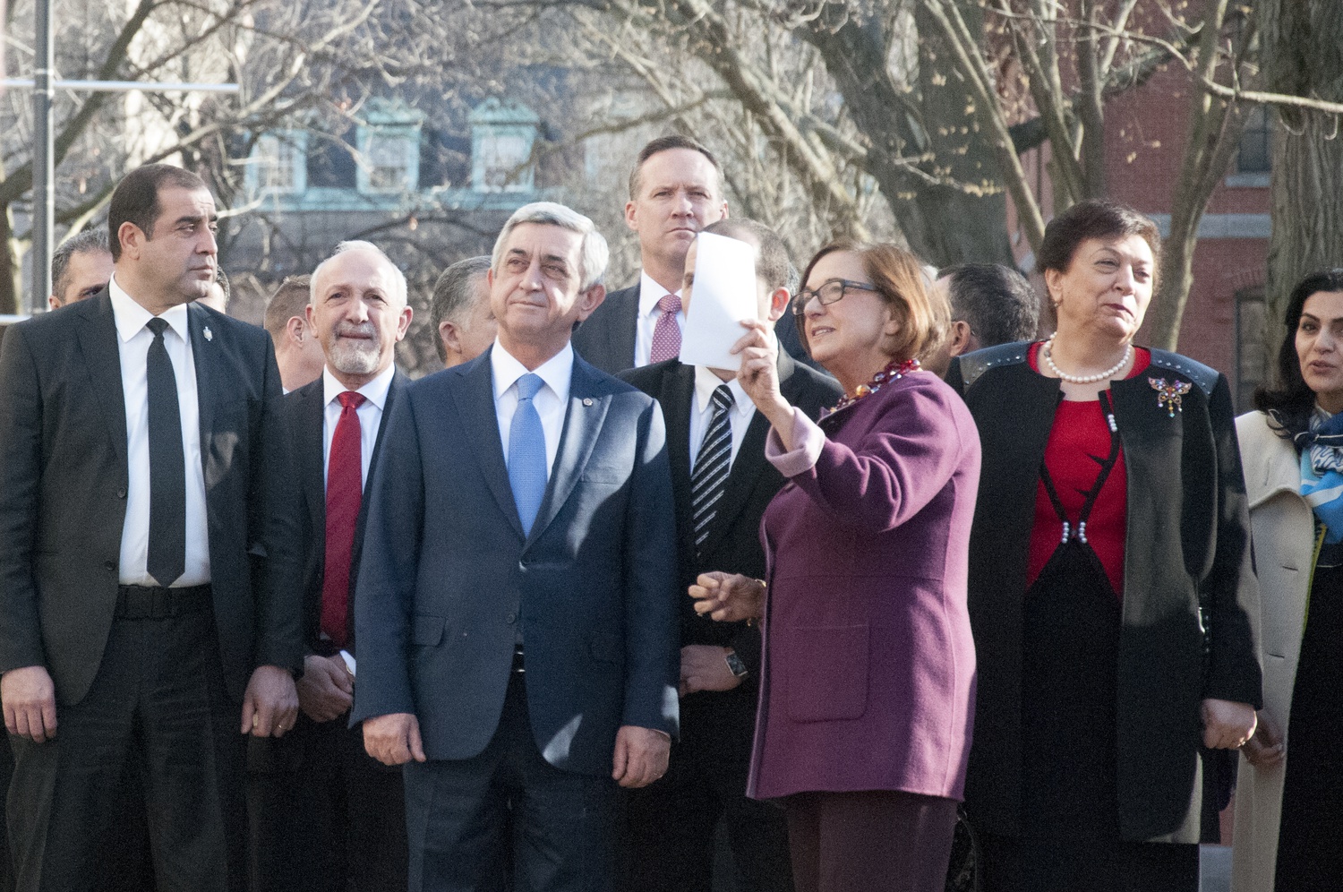 University Marshal Jackie O'Neill gives a campus tour to Armenian President Serzh Sargsyan in Harvard Yard on Wednesday afternoon.