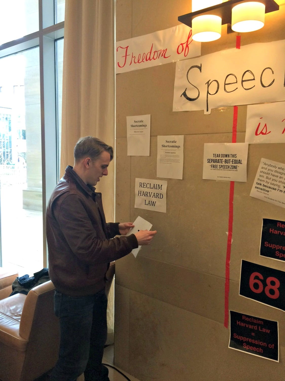 Third-year Law student William H. Barlow put up signs in the WCC student center as part of an ongoing debate about free speech.