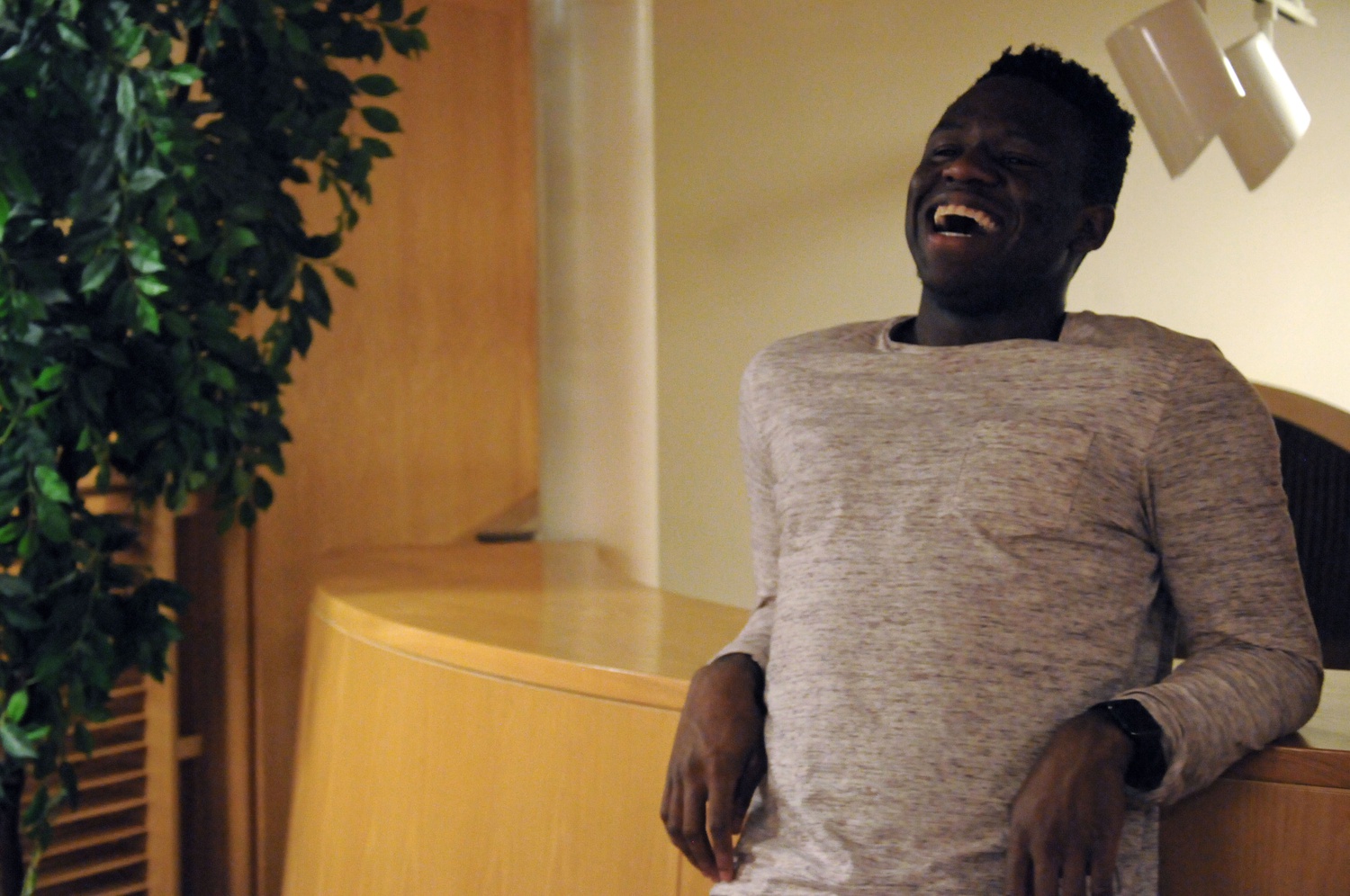 Victor C. Agbafe ’19 rests on the mezzanine of Ticknor Lounge as he discusses his vision for the future of the Undergraduate Council. Last semester, four freshmen were chosen to represent their respective yards on the Undergraduate Council. 