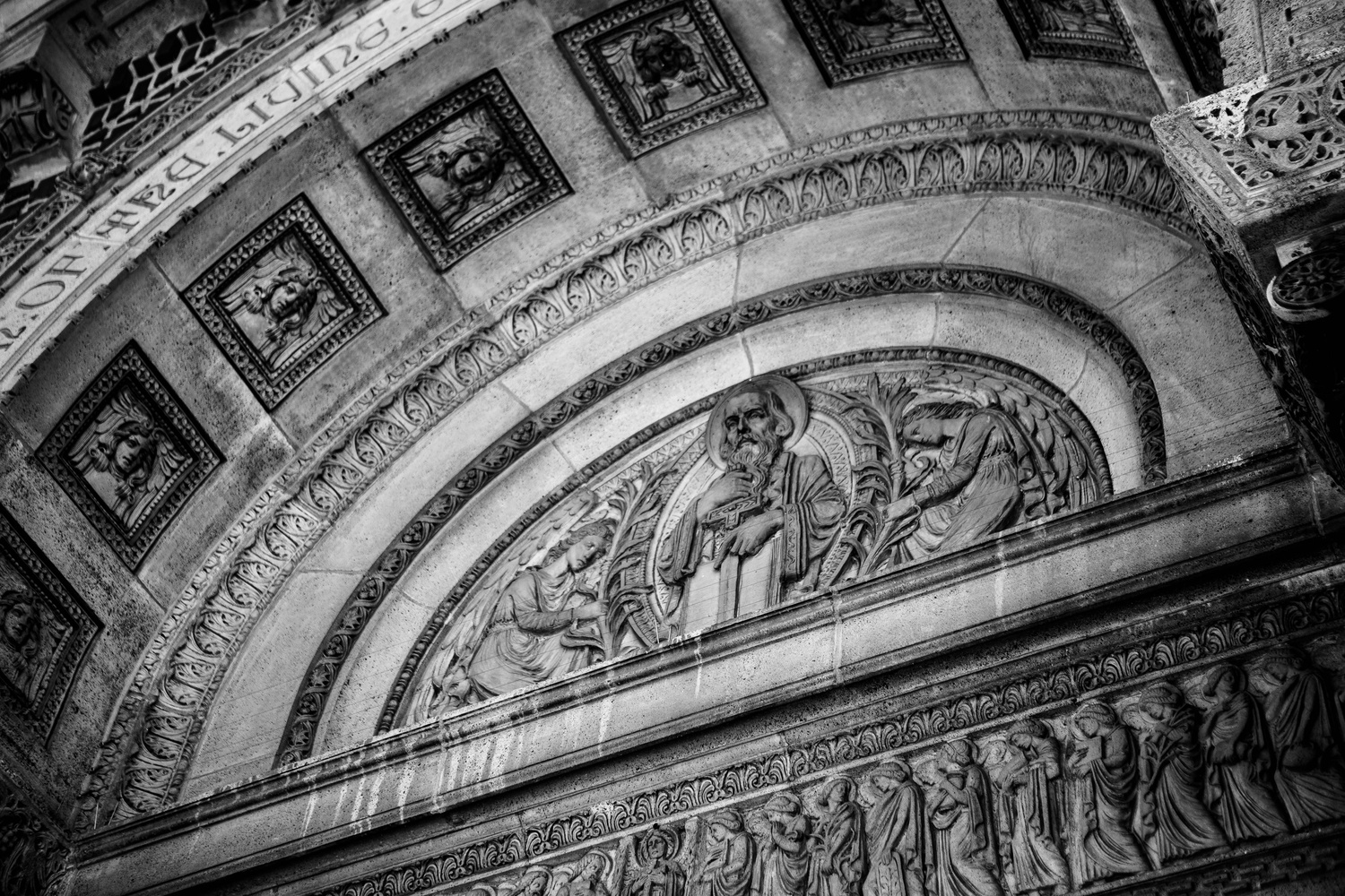 A carving lies above the door of St. Paul Catholic Church in Harvard Square.