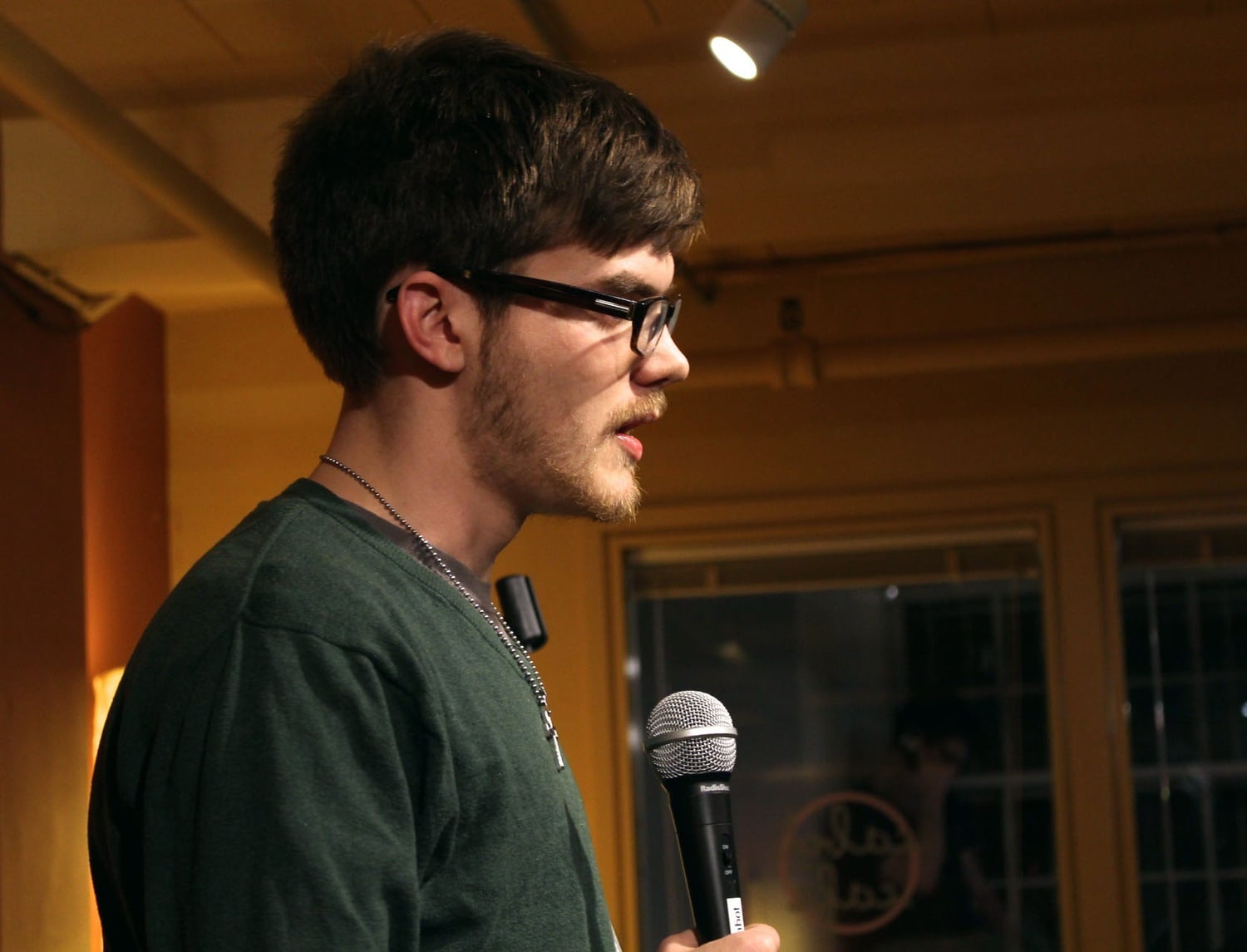 John S. Acton ’17 speaks  last month at the HCFA “You Are More” open mic in Cabot Cafe. The event was co-sponsored by SMHL.