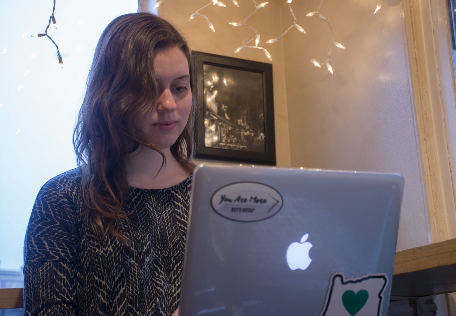 Kate J. Massinger ‘16, outgoing HCFA co-president, reads scripture off of her laptop in Zinnekins.  It’s common for HCFA members to meet together one on one and with ministry staff in coffee shops like this in Harvard Square.