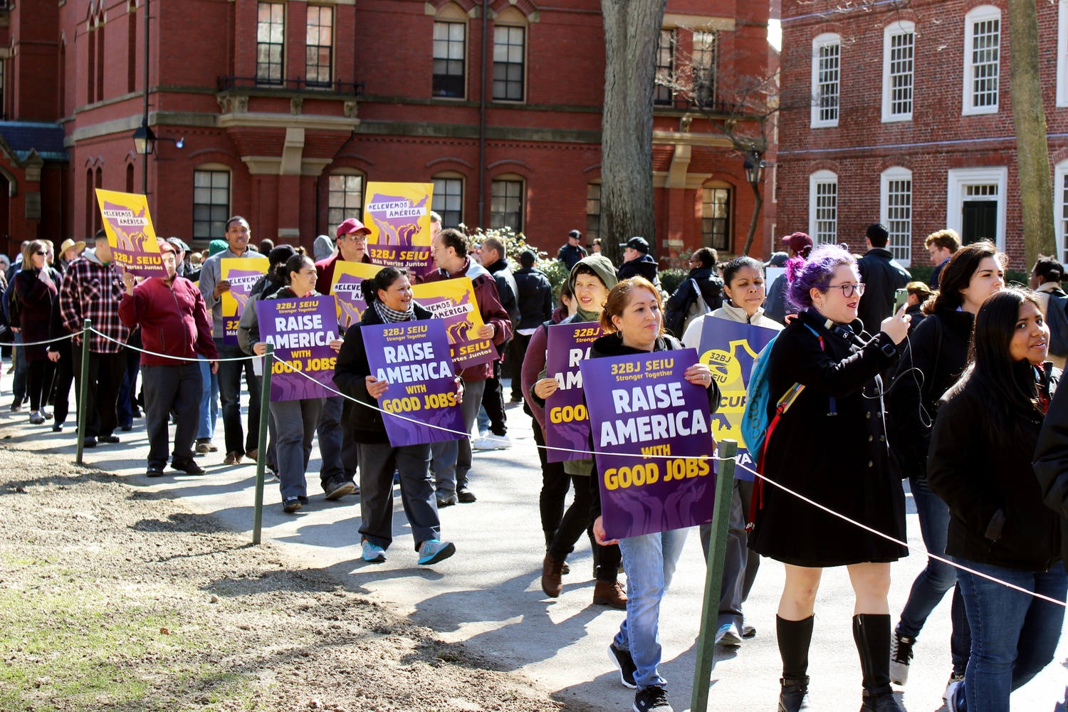 Over 200 Harvard affiliates gather to protest for higher wages and increased health benefits for Harvard University Dining Services Workers. The rally is the latest in a series of events SLAM has hosted since launching their “One Harvard” campaign.