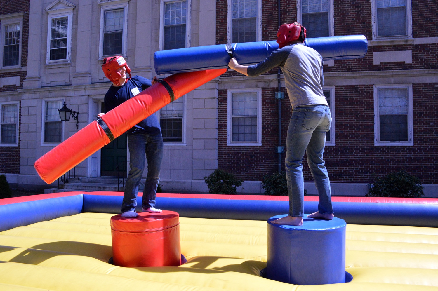 Zachary Gardner ’18 and Dylan R. McDonough ’18 compete in inflatable jousting at Thropstock, a cookout with lawn games and music in Winthrop’s Gore Courtyard on Sunday.