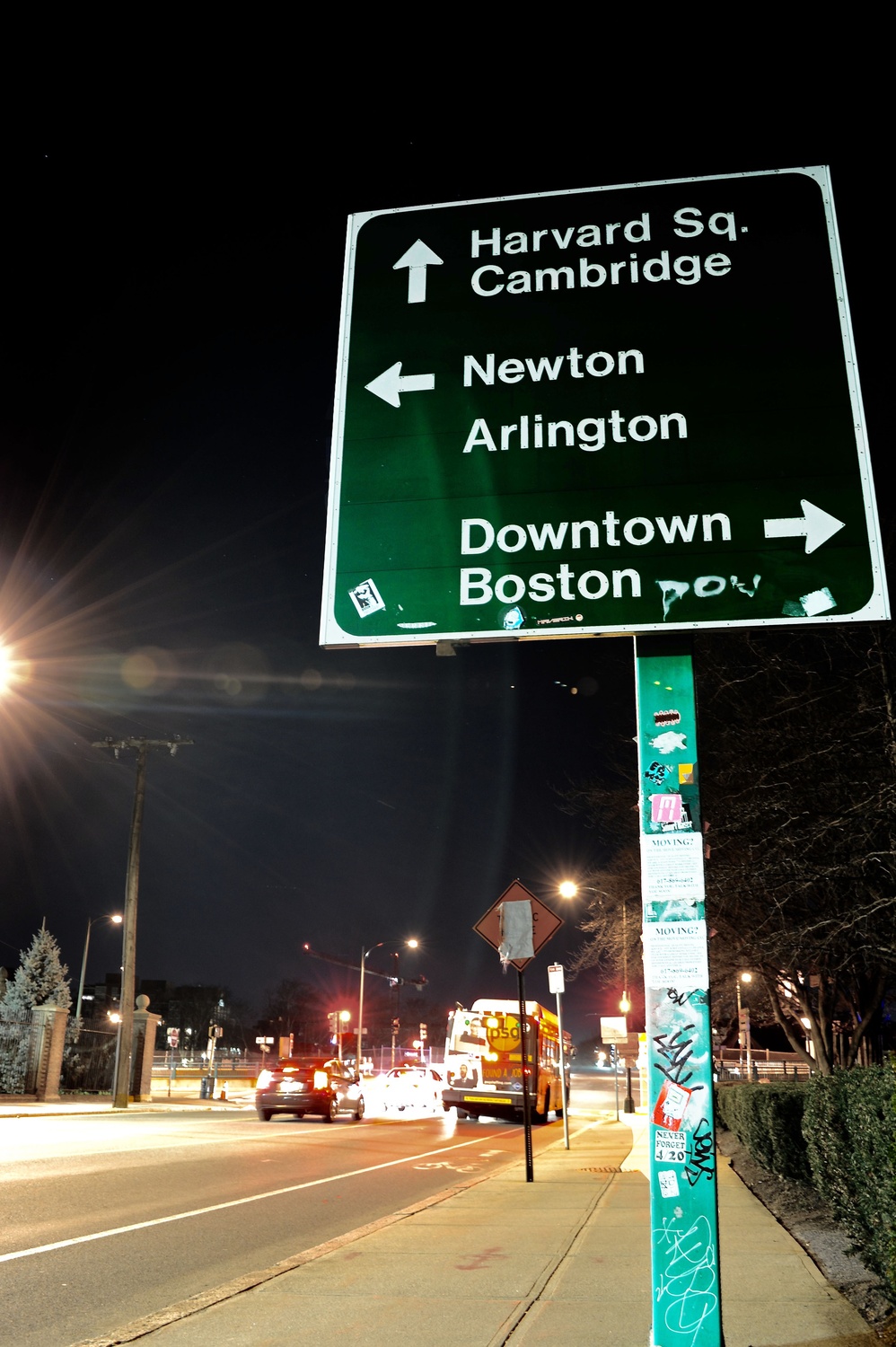 A road sign along North Harvard Street in Allston gives directions to Harvard Square, ahead. Several projects aiming to expand the University's campus to its Allston neighborhood are already underway, with several more set to begin in the next few years. 