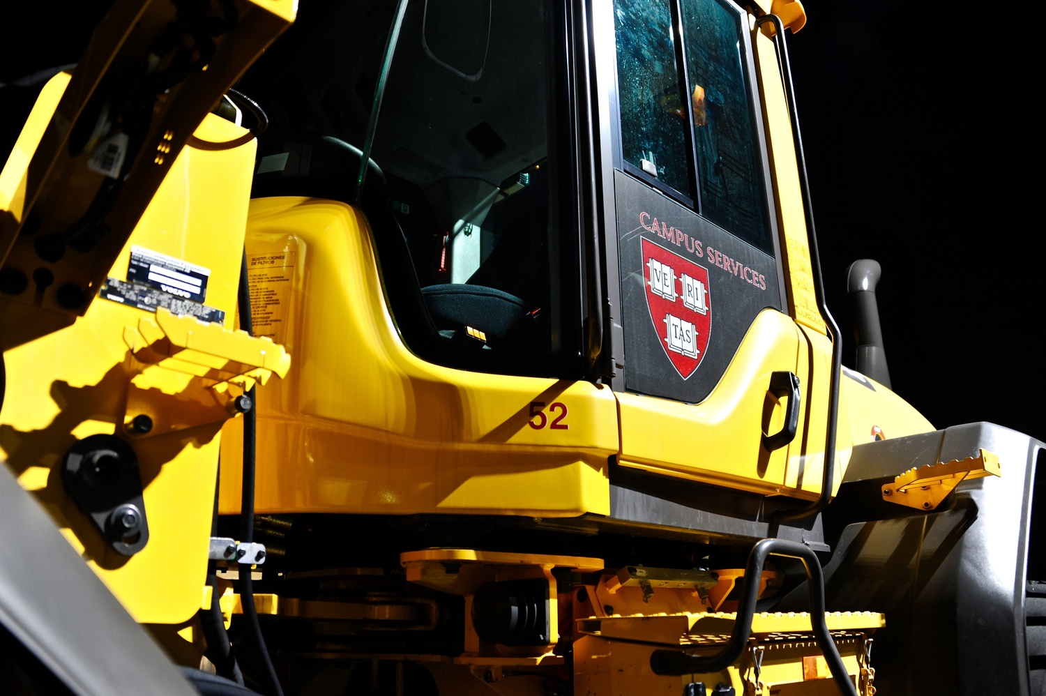 A wheel loader bearing the Harvard crest sits idle on site construction for the new School of Engineering and Applied Sciences complex. Two-thirds of the SEAS faculty is scheduled to move across the Charles in 2020.
