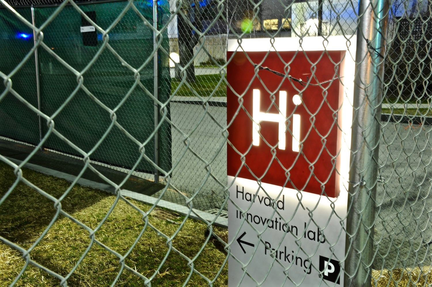 A chain-link fence surrounds a sign for the Harvard Innovation Lab. The University is currently constructing the Harvard Life Lab, slated to open in September 2016, a modular biotech addition to the existing i-lab dedicated to supporting student research and enterprise in biotechnology.