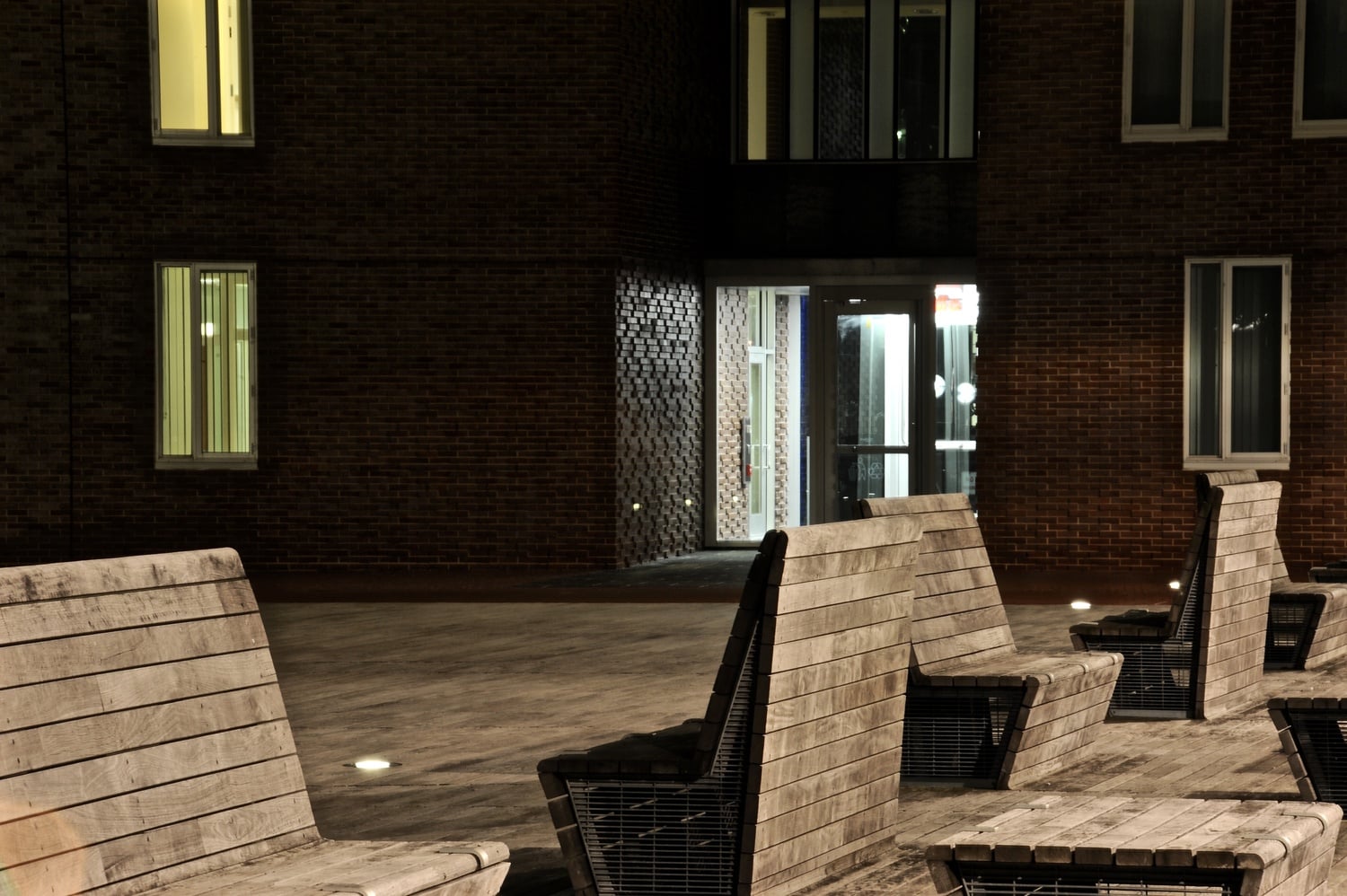 The benches at One Western Avenue sits quiet at night. The project, occupying a prominent site at the southeast corner of the Harvard Business School campus, represented Harvard's first step as it expanded its campus in Allston.