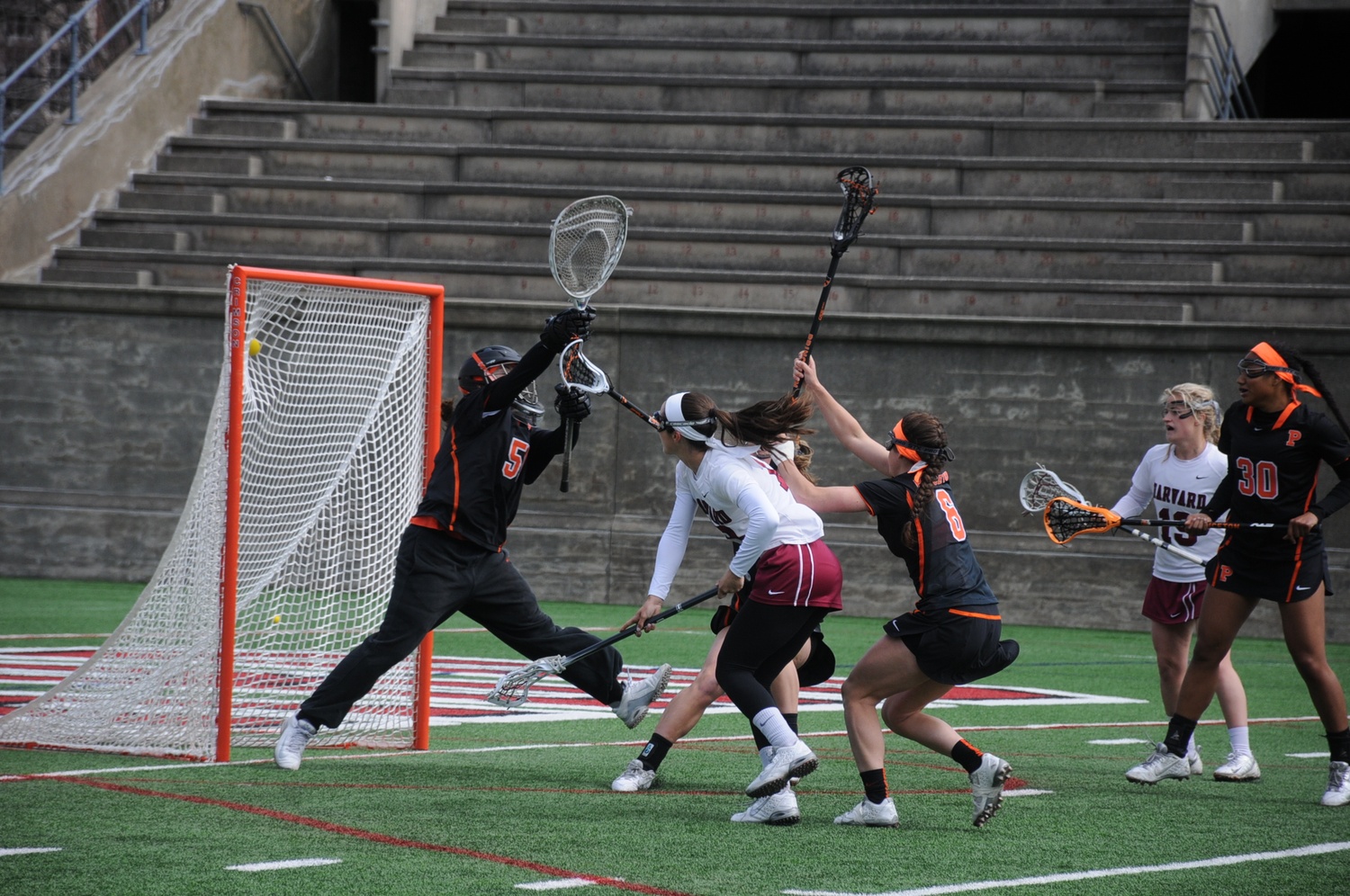Sophomore midfielder Julia Glynn, shown scoring a goal against Princeton last month, had two assists in Harvard’s 16-9 loss to Boston College on Wednesday. The Eagles now have beaten the Crimson six consecutive times.