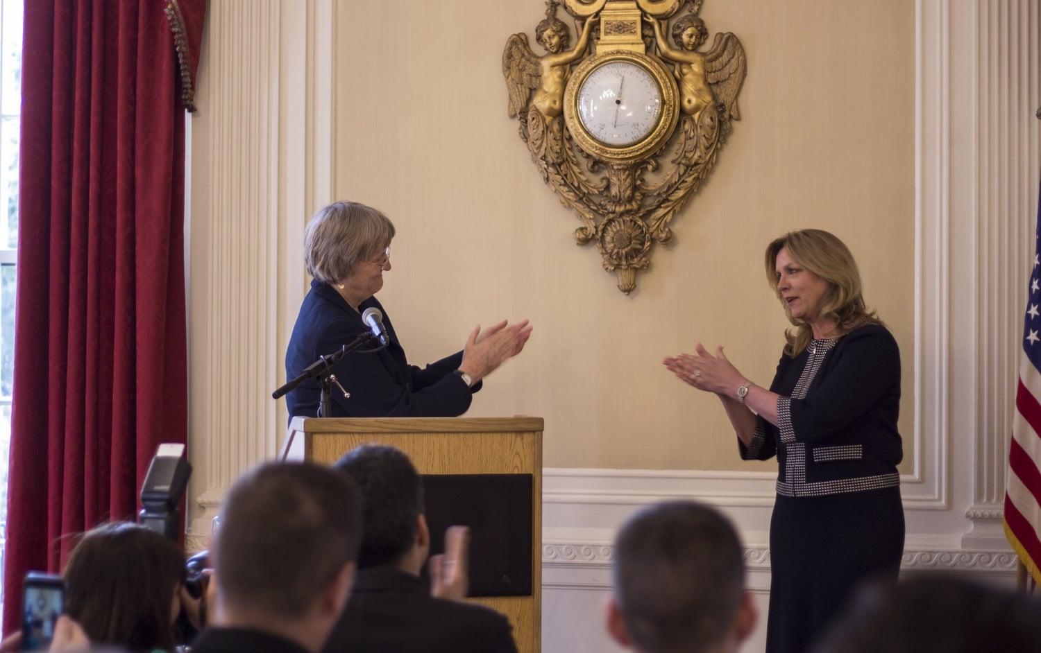 University President Drew G. Faust and Air Force Secretary Deborah Lee James applaud each other before the signing of the agreement through which Harvard officially recognized the Air Force ROTC program.